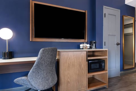 Desk, laptop workspace, iron/ironing board, free cribs/infant beds