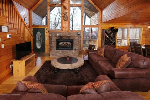 gas log grand fireplace to warm you while relaxing on the sofas