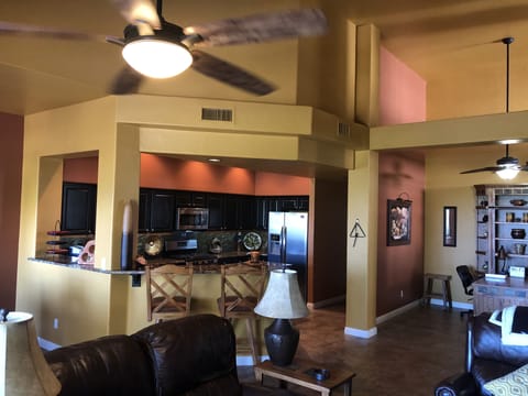Views from living room of kitchen, breakfast bar and office.
