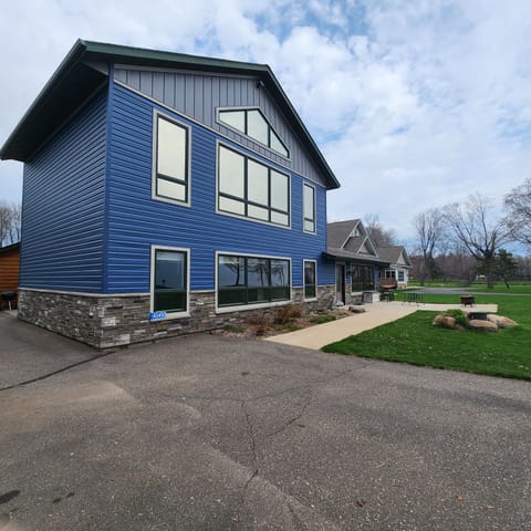 Front of house and parking.  Parking for 3 trucks with boat trailers.