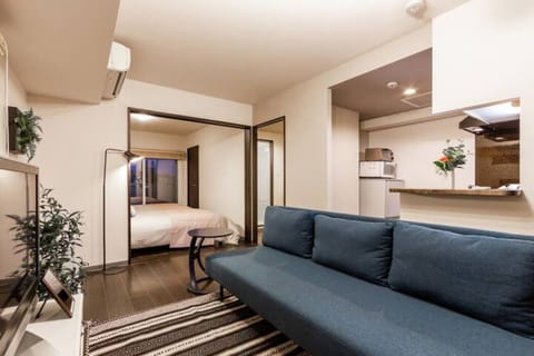 Apartment, Non Smoking | Living area | Flat-screen TV