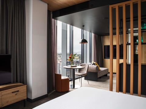 Suite, City View | Premium bedding, minibar, in-room safe, individually decorated