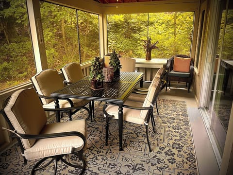 Enjoy screened porch for relaxing or have dinner with new table set