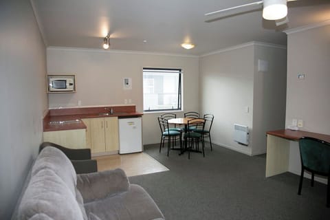 Apartment, 2 Bedrooms | Living area | 32-inch flat-screen TV with digital channels, TV, DVD player