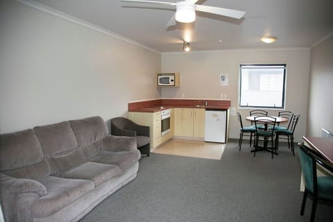 Apartment, 2 Bedrooms | Living area | 32-inch flat-screen TV with digital channels, TV, DVD player