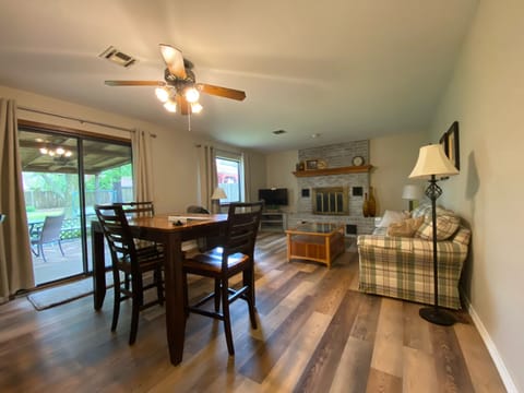 The kitchen opens to the living room. Dining table seats 6. 