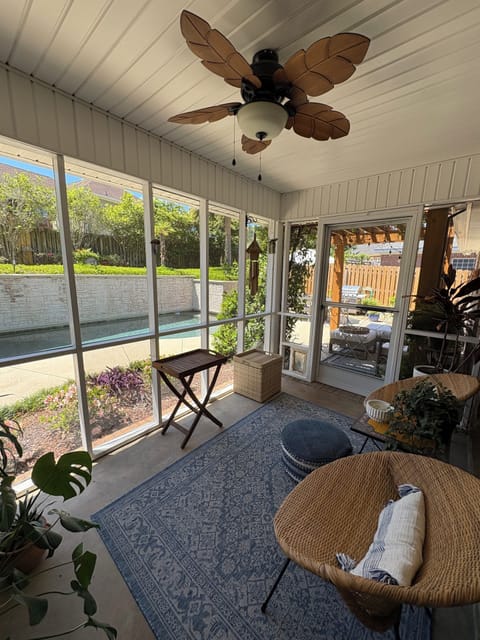 Screened porch leading to the pergola and pool.