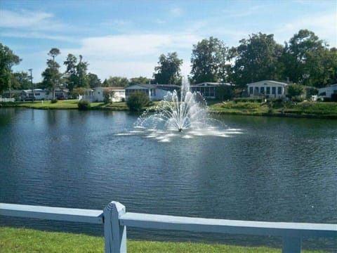 The Fountain view from the deck, this vacation house sits on this man-made lake for awesome views!