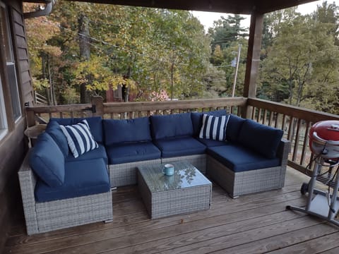 Sitting area and sunset view from front deck with electric grill.