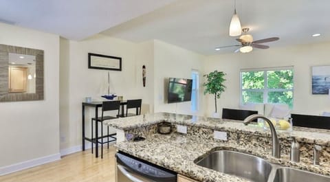 Modern kitchen already stocked with some spices, several coffees, and creamer.