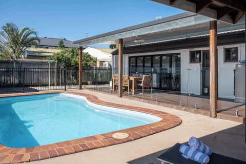 Large outdoor space with refreshing pool.