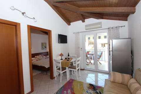 Apartment, 1 Bedroom, Smoking, Balcony | Living area | 40-inch flat-screen TV with satellite channels, TV