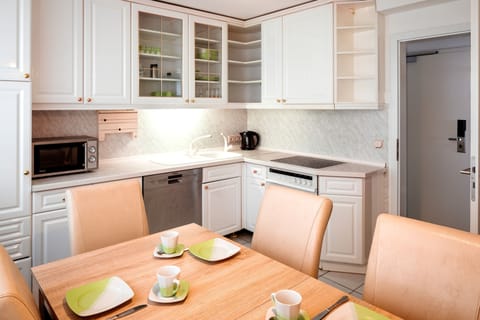 Apartment, 2 Bedrooms | Private kitchen | Fridge, stovetop, coffee/tea maker, electric kettle