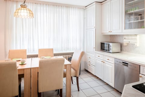 Apartment, 2 Bedrooms | Private kitchen | Fridge, stovetop, coffee/tea maker, electric kettle