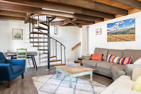 Living room with spiral staircase