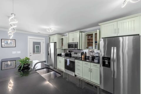 Cook up a feast in the fully equipped kitchen featuring stainless steel appliances. Dishwasher for easy clean up. Coffee maker for all the 