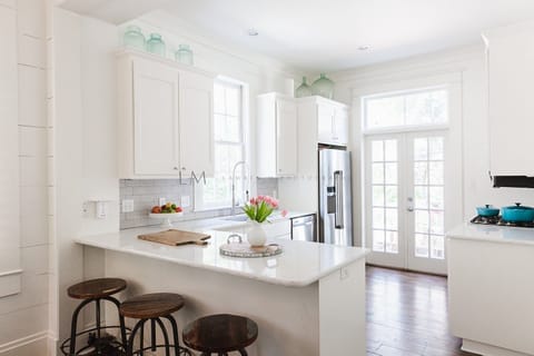 LIGHT AND BRIGHT KITCHEN WITH BAR SEATING FOR THREE