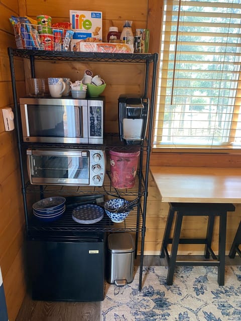 Kitchenette features Mini Fridge, Toaster Oven, Microwave & Keurig Coffee Maker
