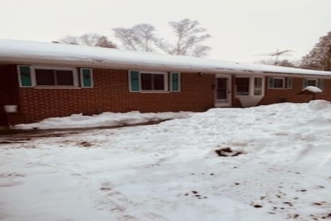 Road view of main house; winter