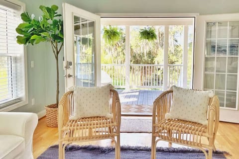 Enjoy the coastal evening breeze in this seating section that opens up to the covered porch. 
