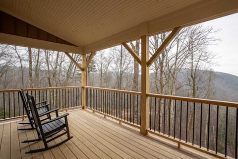 Enjoy Coffee on the Covered Deck in these Comfortable Rocking Chairs