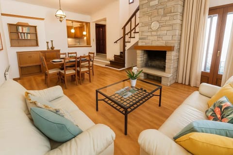 Living Room – Cozy and Sunlit Interior
Relax with comfortable sofas and a warm, homely atmosphere.