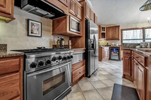 Kitchen with 6 burner stove, warming tray oven and radiant floor heat
