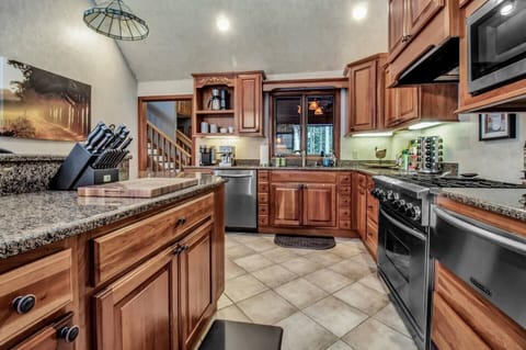 Kitchen with 6 burner stove, warming tray oven and radiant floor heat