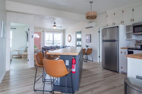 Newly renovated kitchen. All new stainless steel appliances. Butcher block bar that seats 5, plus table that seats 4.