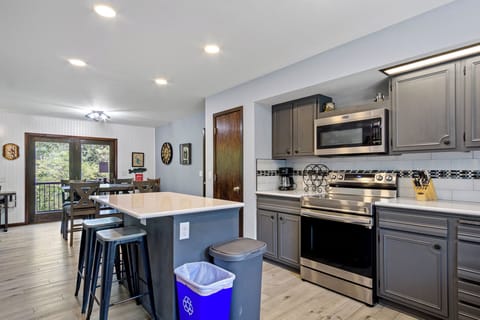 Kitchen, dining room and door out to the patio.