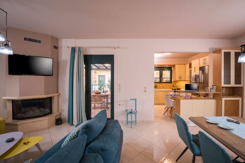 Exclusive Villa | Living room | 42-inch flat-screen TV with satellite channels, TV, fireplace