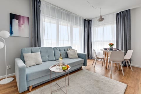 Deluxe Apartment, 1 Bedroom, City View | Living room | Flat-screen TV