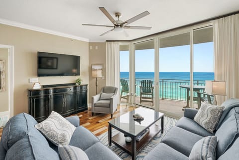 Your bright oceanfront living room opens to a private balcony where endless sea views await. Relax with coastal breezes flowing through.