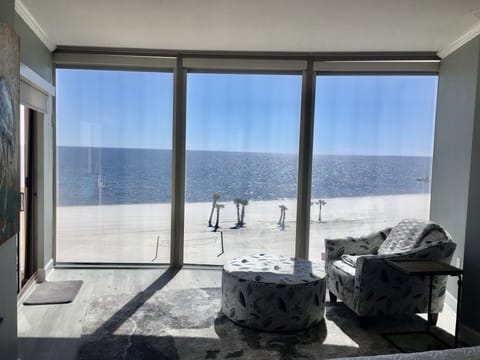 Floor to ceiling windows in master. View from king bed.