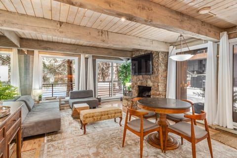 This corner unit at Chateau Roaring Fork offers wall to wall windows creating a bright and inviting space to unwind during your visit to Aspen.