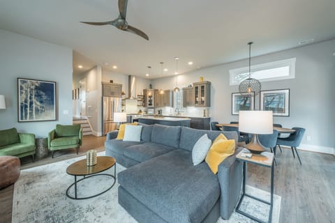 Open living, dining, and kitchen on the main level.