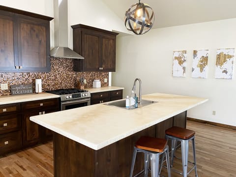 Kitchen—Equipped with a stainless steel propane oven and stovetop