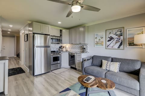 Main Living Area - The main living area in this condo with all brand new furnishings include the all stainless and granite kitchen, wood grain tile floors and new wood cabinets. The living room area has a new sofa w/queen sleeper. The room opens to the balcony overlooking the ocean.