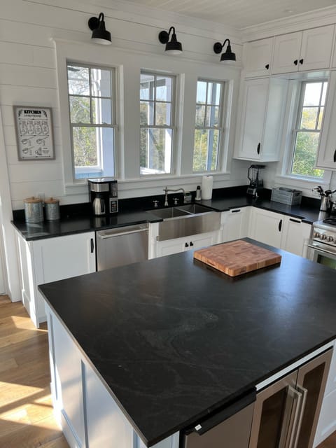 Gorgeous professional kitchen; farm sink, island with ice maker, wine frig.