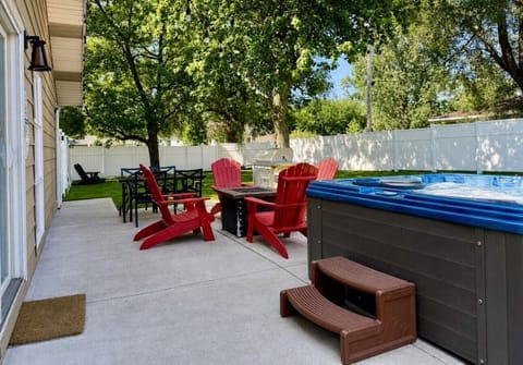 Private year-round hot tub, gas firepit and outdoor dining in the fenced backyard.