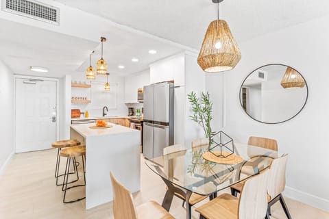 Dining area seats six  with open kitchen perfect ambiance for meals and memories.