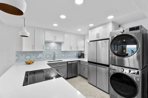 Fully equipped kitchen with in-unit washer & dryer