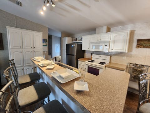 Full Kitchen w/Microwave, stove, dishwasher, coffee maker, toaster, etc.