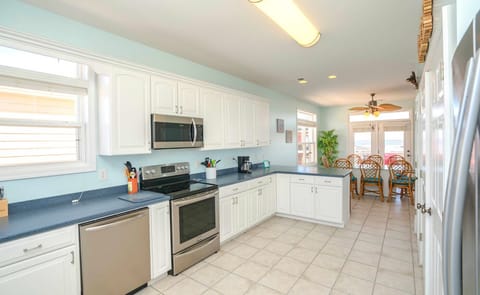 Kitchen with SS appliances and views of the ocean and ICW
