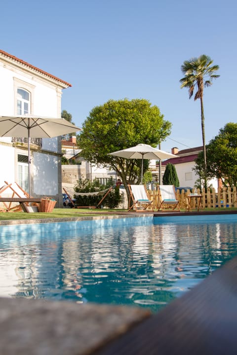 Outdoor pool, pool umbrellas, sun loungers