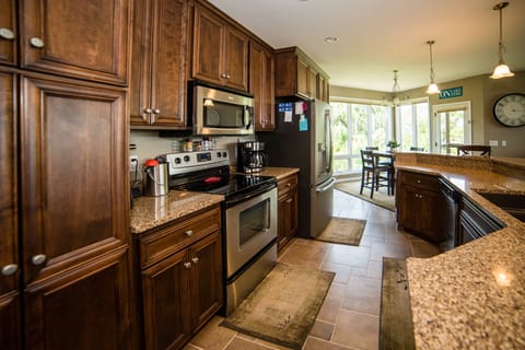 Fully supplied kitchen including a single-serve or 12-cup coffee maker.