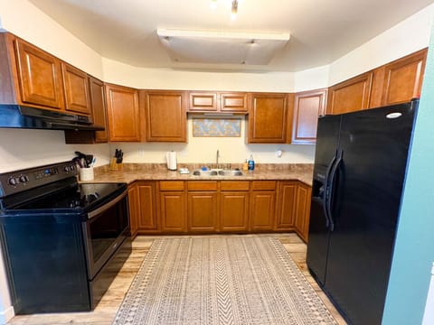 Full size kitchen and appliances, fully stocked for cooking with pots/pans and spices provided.