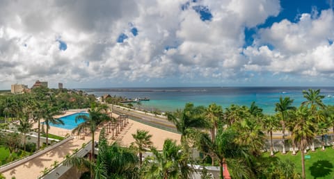View from the balcony: pool, hot tub, sea and gardens