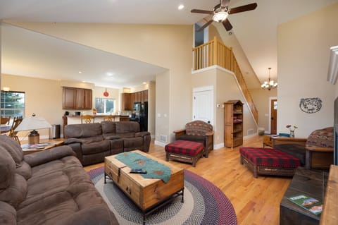 Living room and kitchen, stairs to upstairs hall
