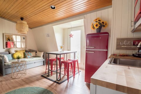 Living room/dining area with twin daybed with trundle